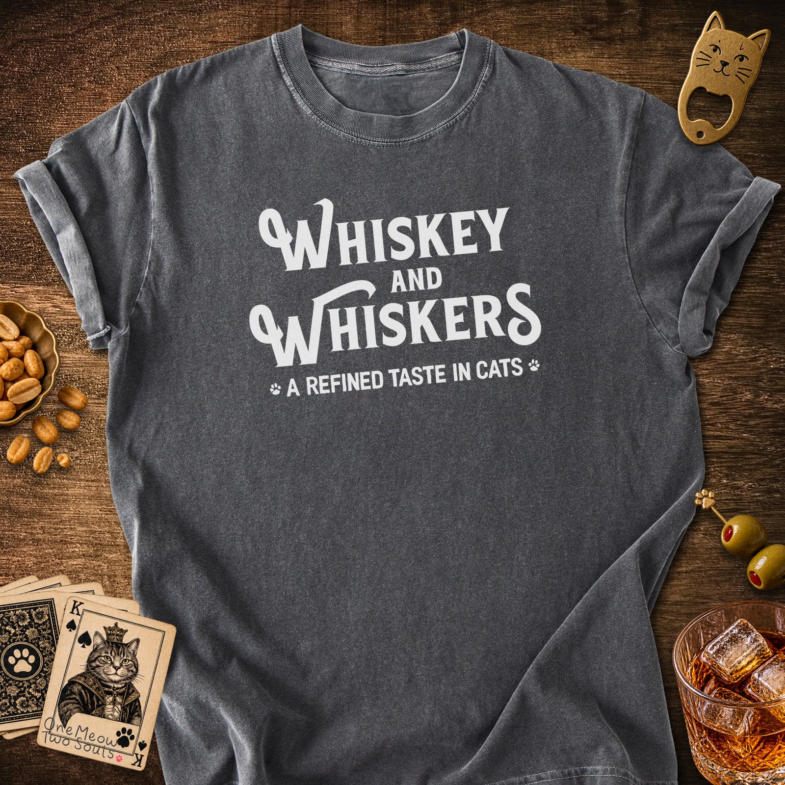 Pepper colored Comfort Colors 1717 cotton T-shirt, with a "Whiskey and Whiskers" design. One Meow Two Souls brand.