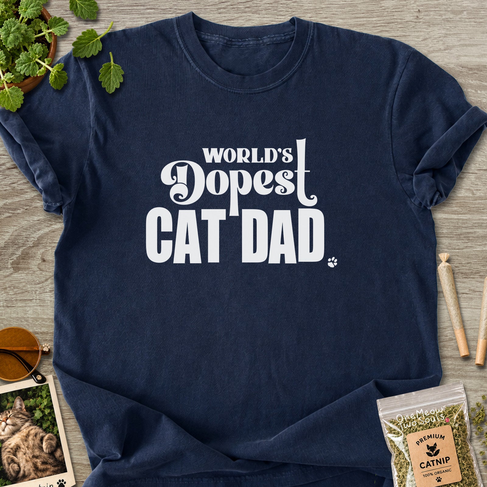 Navy colored Comfort Colors 1717 cotton T-shirt, featuring a "World's Dopest Cat Dad" funny cat design illustration. One Meow Two Souls brand.