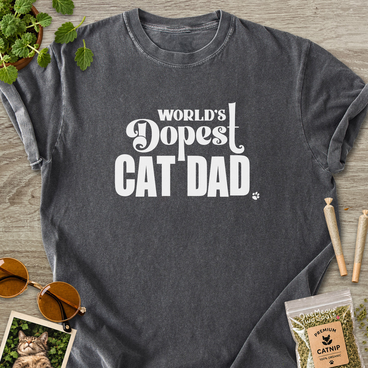 Pepper colored Comfort Colors 1717 cotton T-shirt, featuring a "World's Dopest Cat Dad" funny cat design illustration. One Meow Two Souls brand.