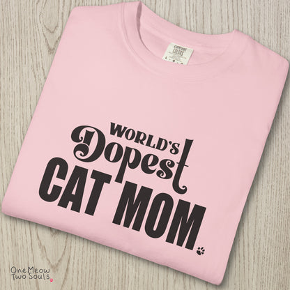 Blossom colored Comfort Colors 1717 cotton T-shirt, featuring a "World's Dopest Cat Mom" funny cat design illustration. One Meow Two Souls brand.