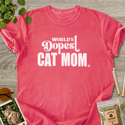 Watermelon colored Comfort Colors 1717 cotton T-shirt, featuring a "World's Dopest Cat Mom" funny cat design illustration. One Meow Two Souls brand.