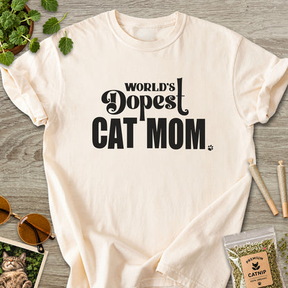 Ivory colored Comfort Colors 1717 cotton T-shirt, featuring a "World's Dopest Cat Mom" funny cat design illustration. One Meow Two Souls brand.