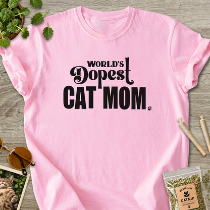 Blossom colored Comfort Colors 1717 cotton T-shirt, featuring a "World's Dopest Cat Mom" funny cat design illustration. One Meow Two Souls brand.