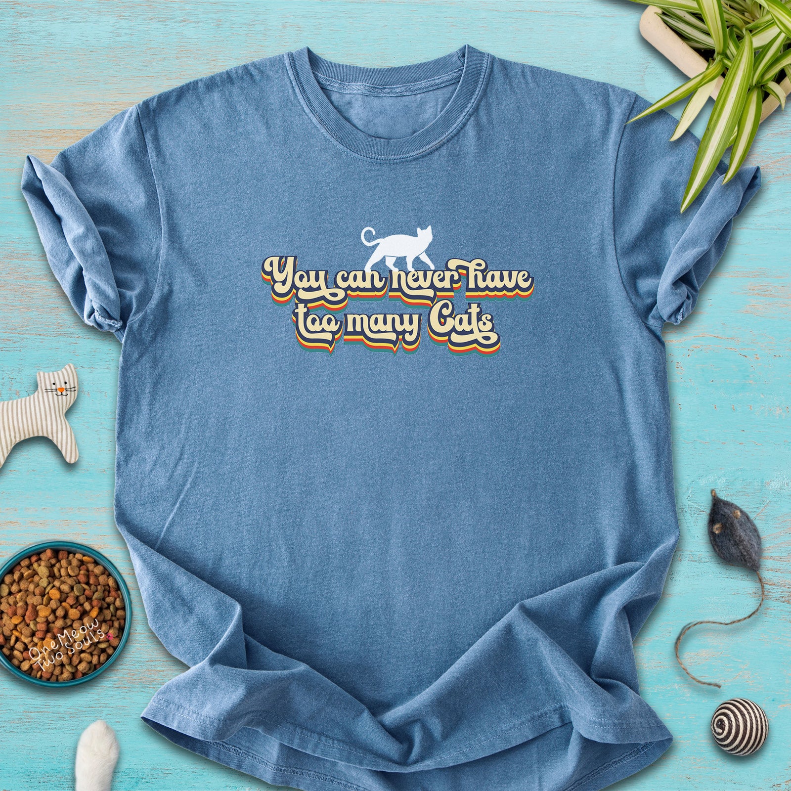 Blue Jean colored Comfort Colors 1717 cotton T-shirt, presenting a "You can never have too many cats" funny cat design. One Meow Two Souls brand.