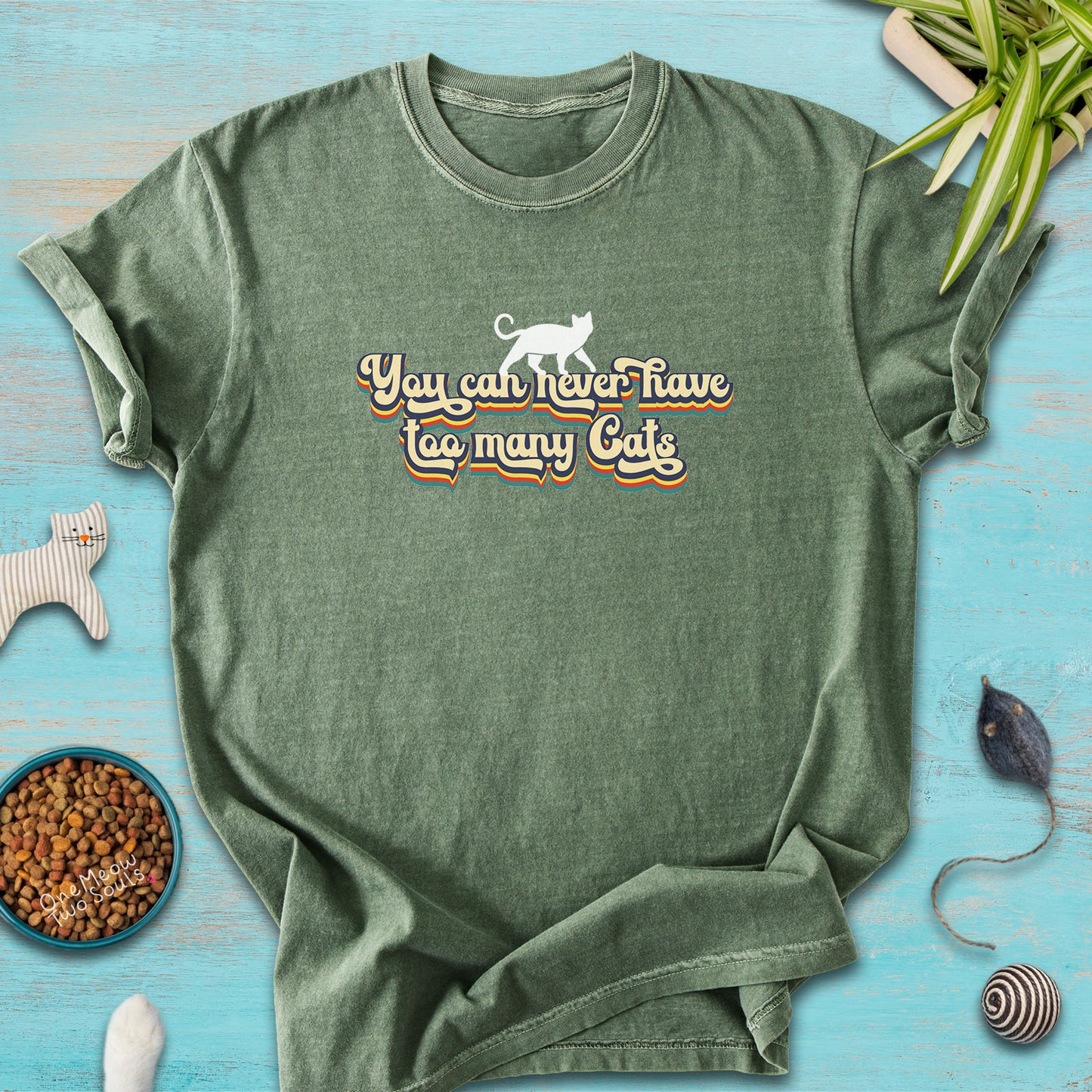 Moss colored Comfort Colors 1717 cotton T-shirt, presenting a "You can never have too many cats" funny cat design. One Meow Two Souls brand.