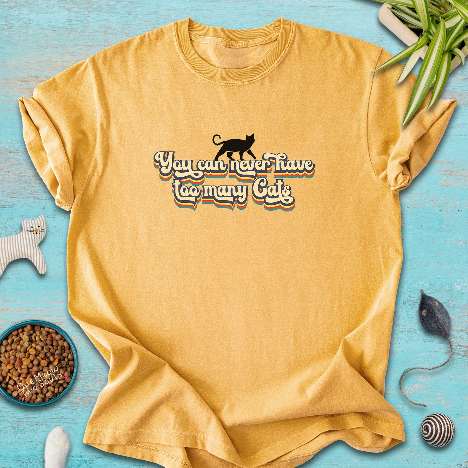Mustard colored Comfort Colors 1717 cotton T-shirt, presenting a "You can never have too many cats" funny cat design. One Meow Two Souls brand.