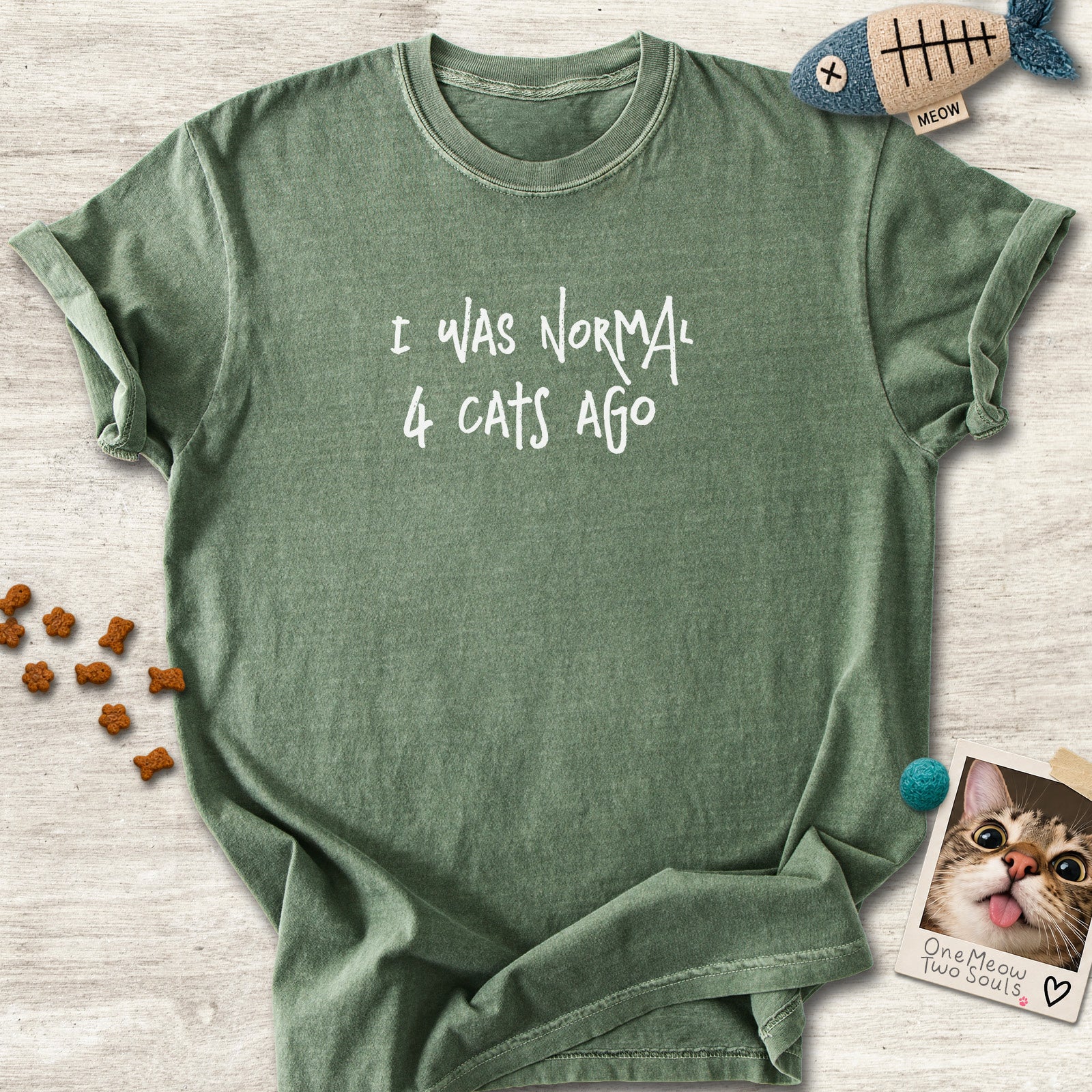 Moss colored Comfort Colors 1717 cotton T-shirt, featuring a "I was normal 4 cats ago" funny cat design illustration. One Meow Two Souls brand.