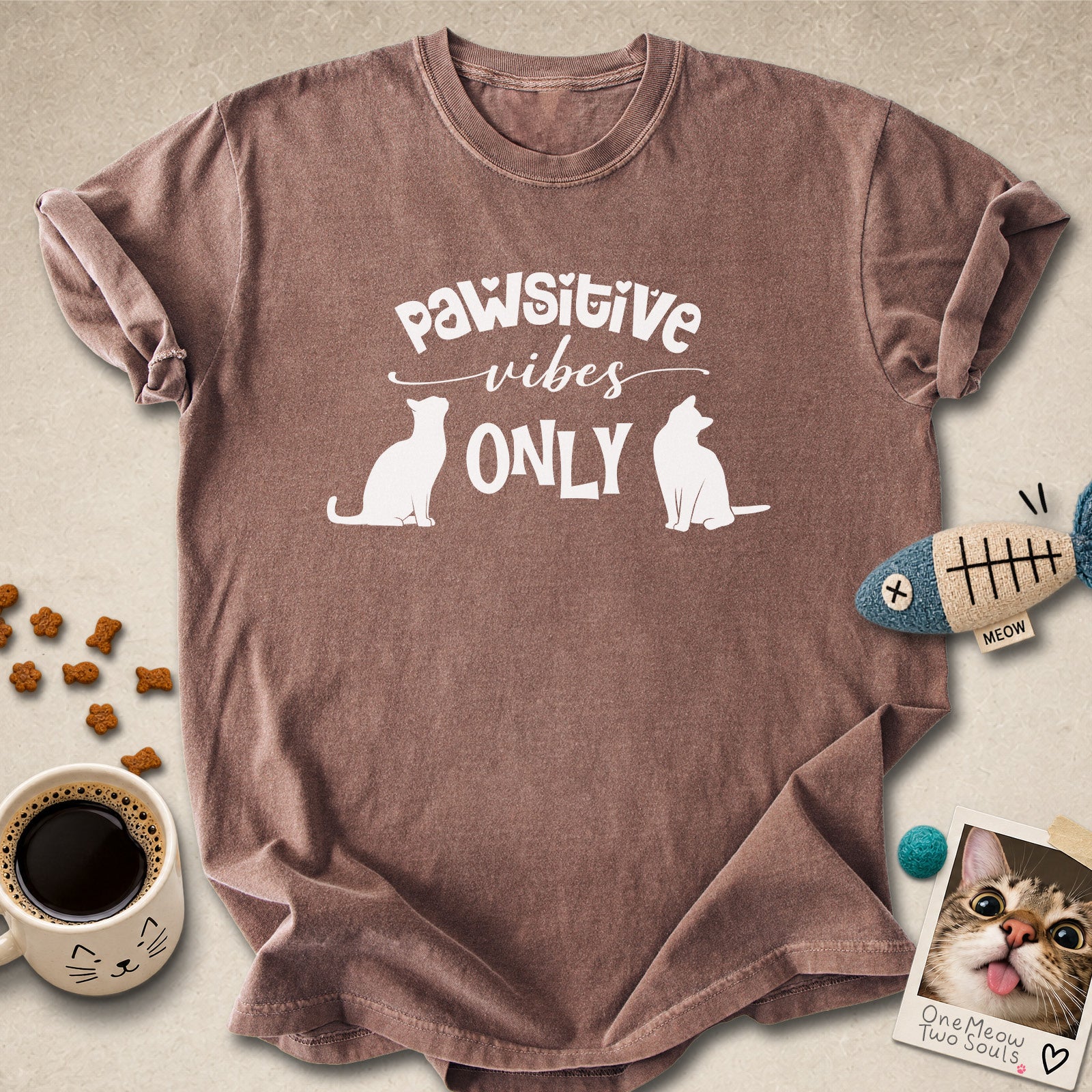 Espresso colored Comfort Colors 1717 cotton T-shirt, featuring a "Pawsitive Vibes Only" funny cat design illustration. One Meow Two Souls brand.
