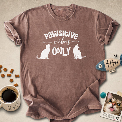 Espresso colored Comfort Colors 1717 cotton T-shirt, featuring a "Pawsitive Vibes Only" funny cat design illustration. One Meow Two Souls brand.
