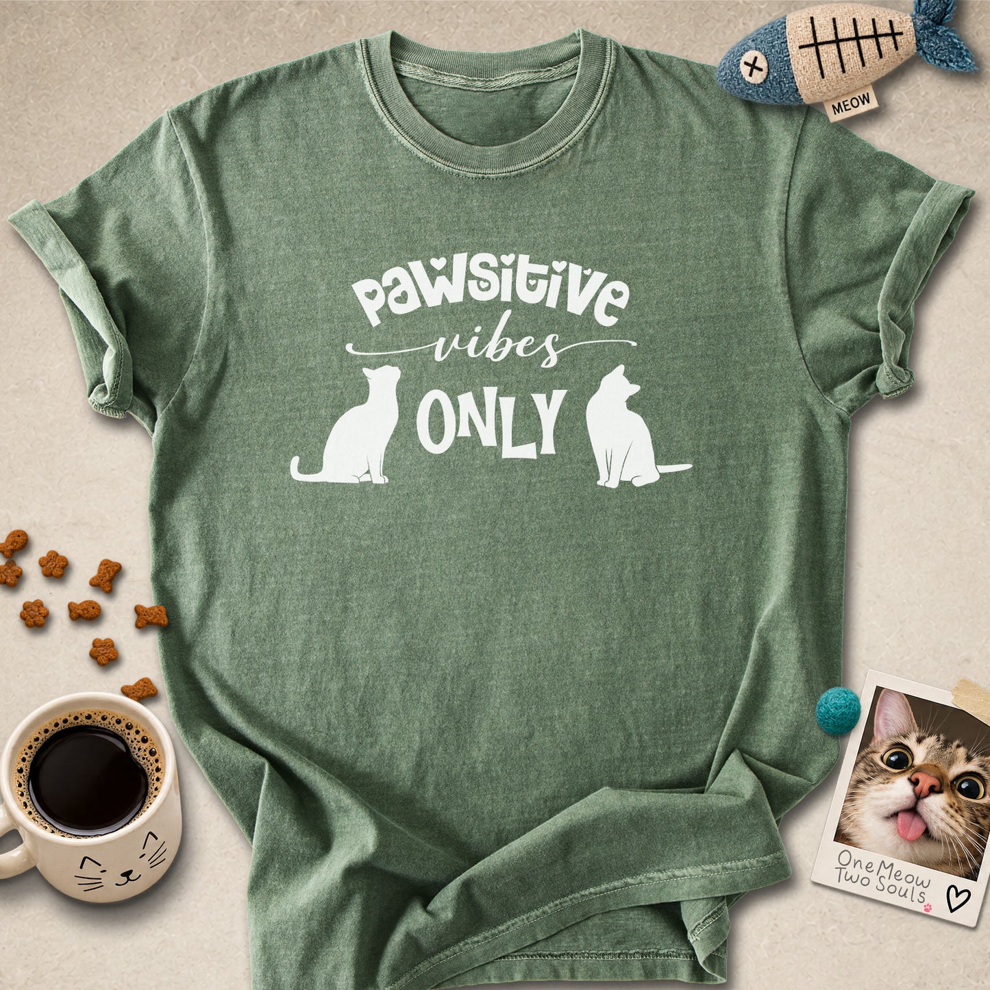 Moss colored Comfort Colors 1717 cotton T-shirt, featuring a "Pawsitive Vibes Only" funny cat design illustration. One Meow Two Souls brand.