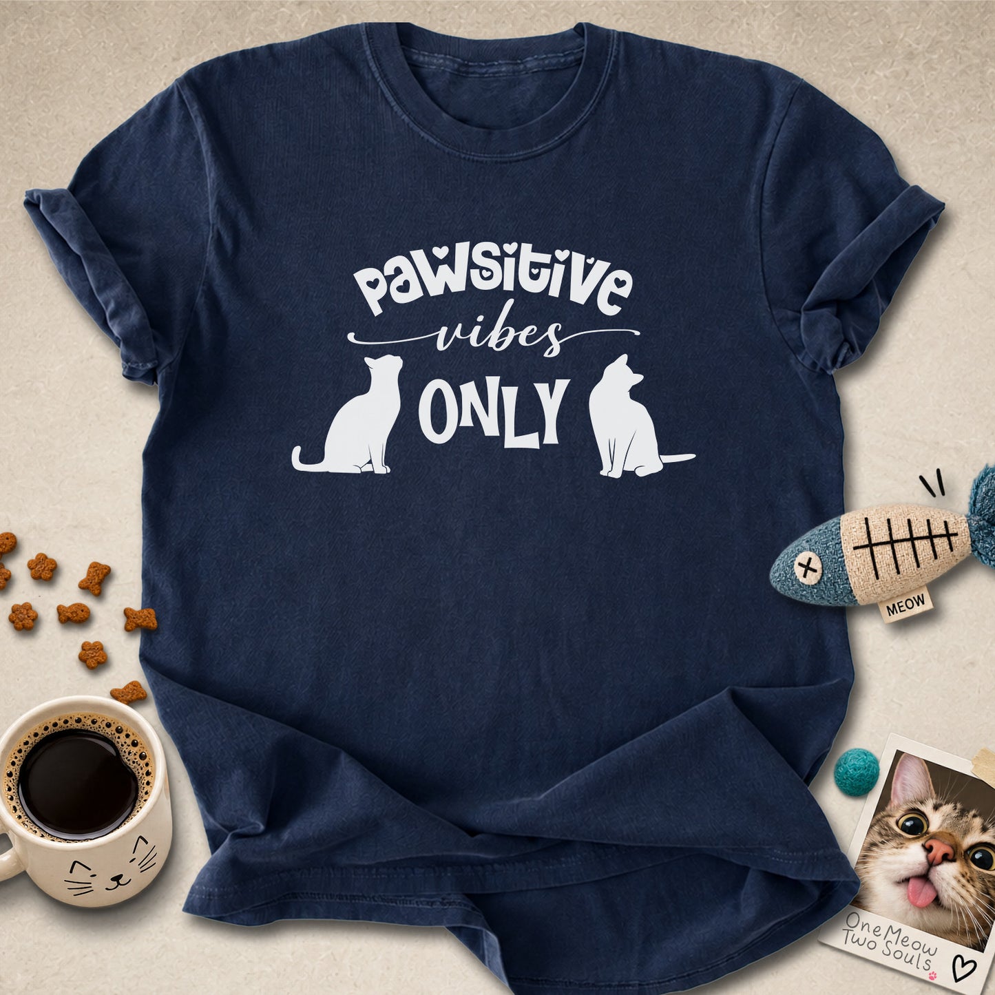 Navy colored Comfort Colors 1717 cotton T-shirt, featuring a "Pawsitive Vibes Only" funny cat design illustration. One Meow Two Souls brand.