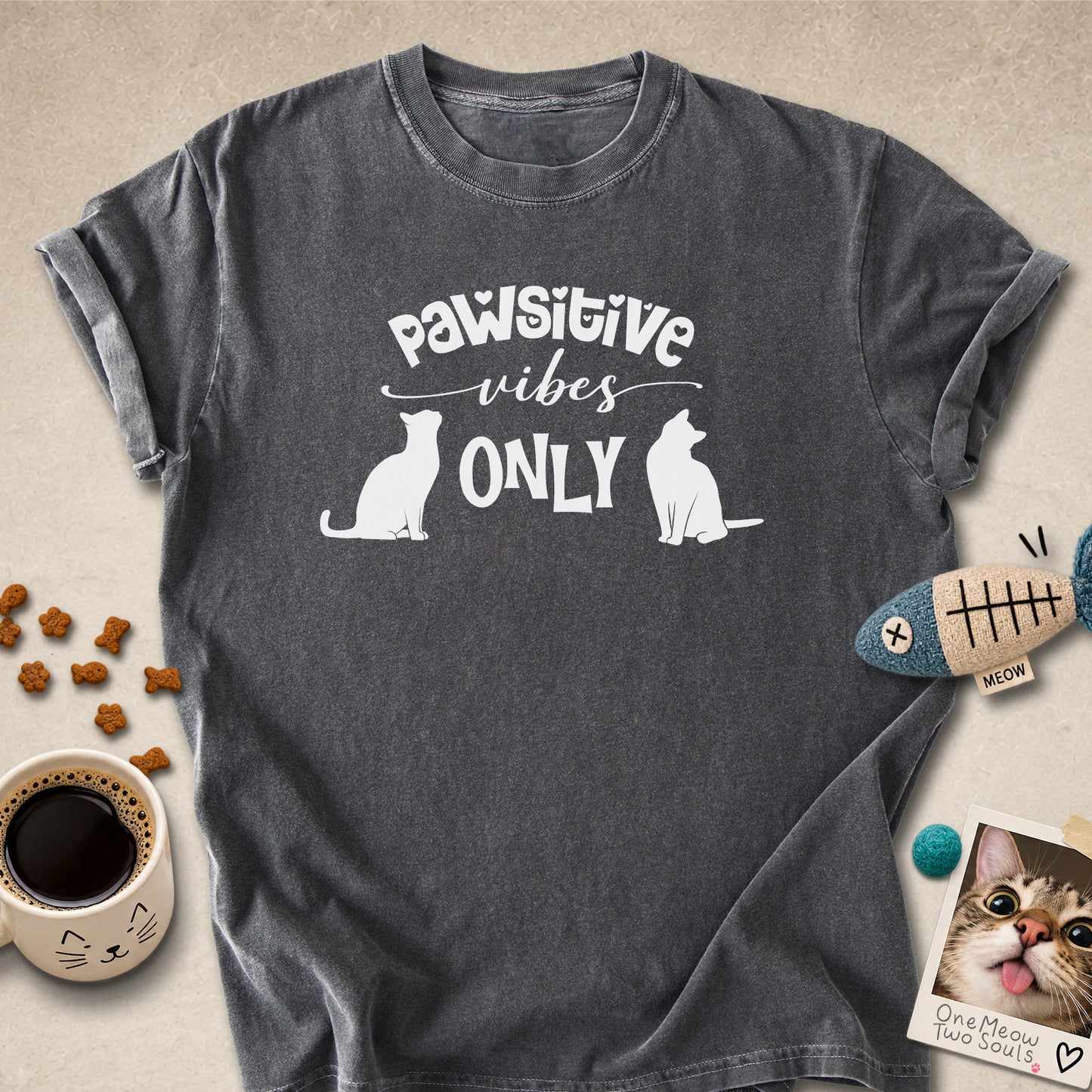 Pepper colored Comfort Colors 1717 cotton T-shirt, featuring a "Pawsitive Vibes Only" funny cat design illustration. One Meow Two Souls brand.