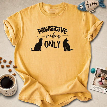 Mustard colored Comfort Colors 1717 cotton T-shirt, featuring a "Pawsitive Vibes Only" funny cat design illustration. One Meow Two Souls brand.