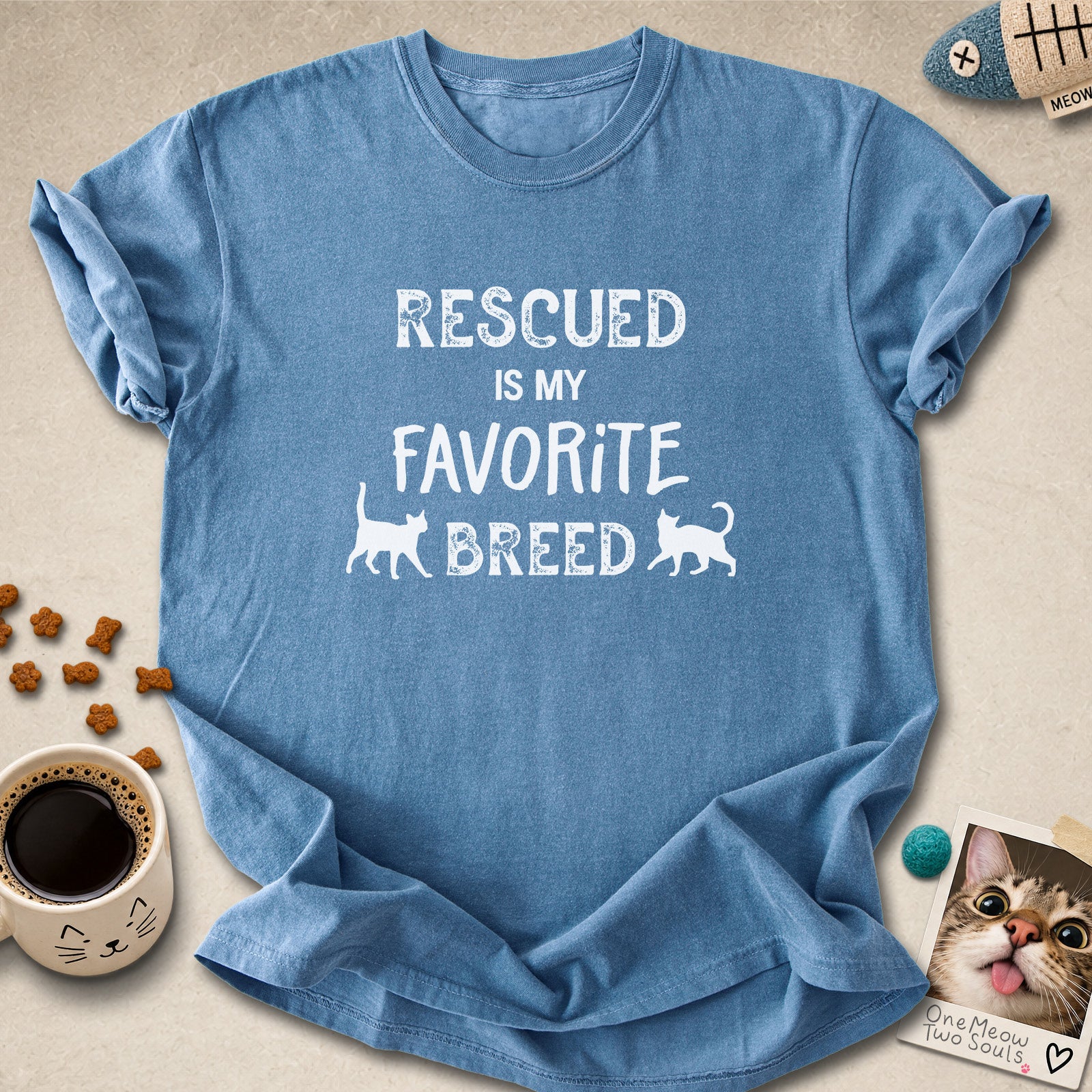 Blue Jean colored Comfort Colors 1717 cotton T-shirt, featuring a "Rescued is my favorite breed" funny cat design. One Meow Two Souls brand.