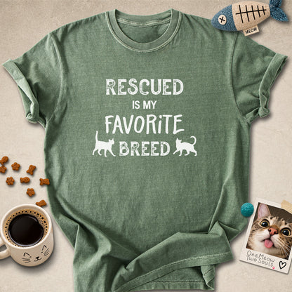 Moss colored Comfort Colors 1717 cotton T-shirt, featuring a "Rescued is my favorite breed" funny cat design. One Meow Two Souls brand.