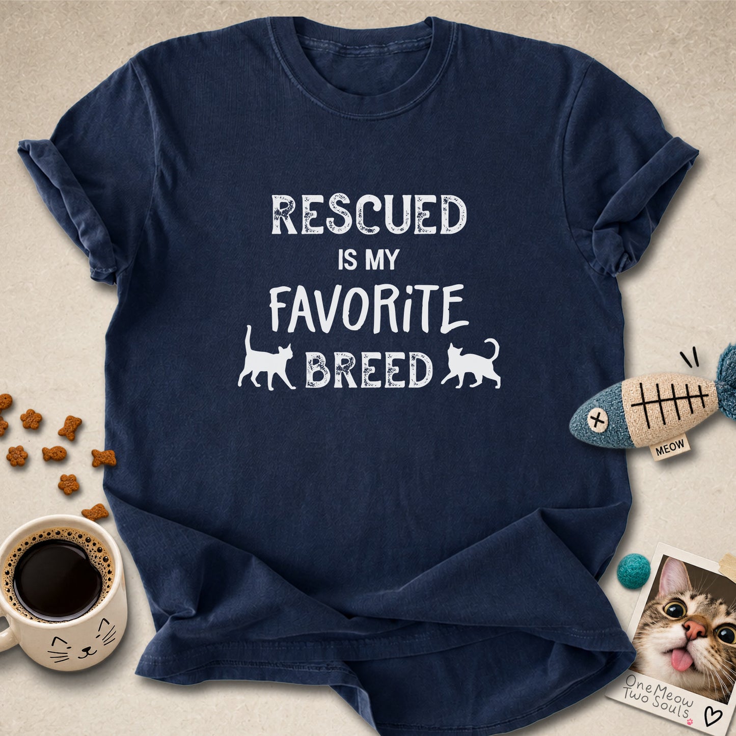 Navy colored Comfort Colors 1717 cotton T-shirt, featuring a "Rescued is my favorite breed" funny cat design. One Meow Two Souls brand.