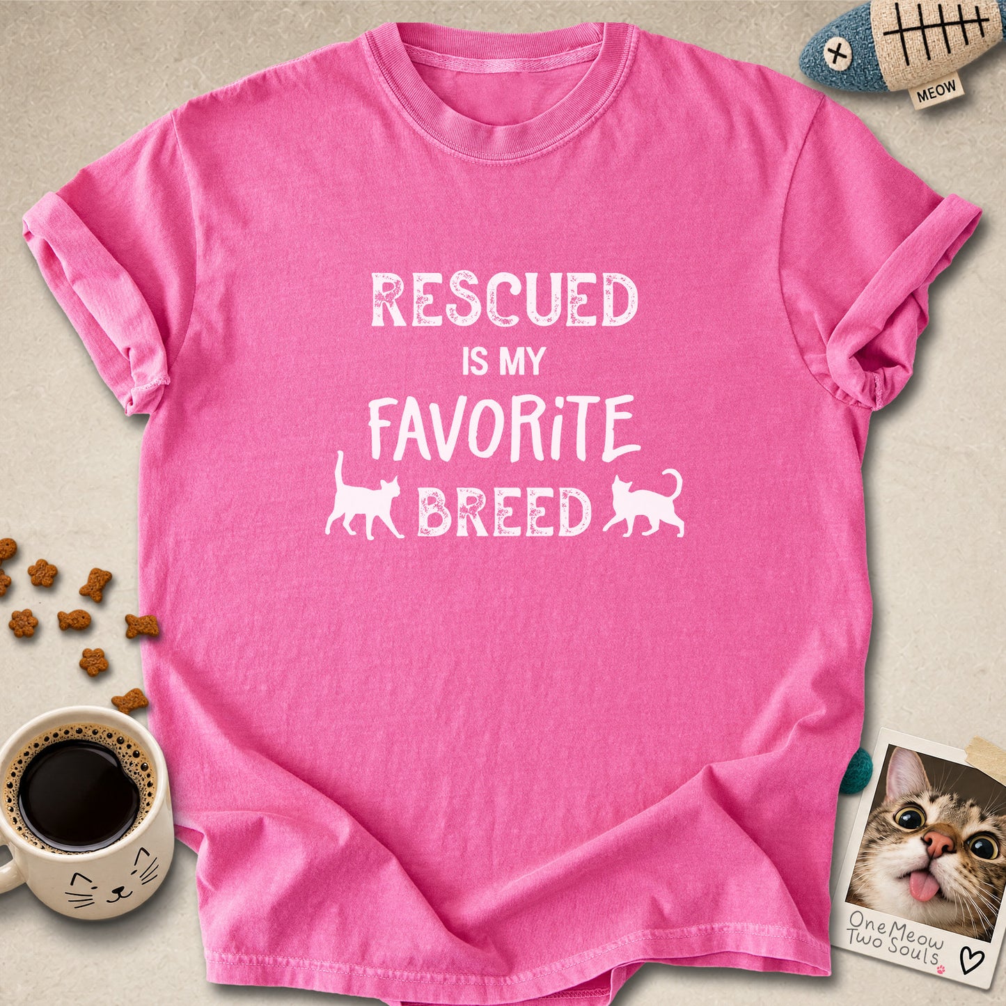 Crunchberry colored Comfort Colors 1717 cotton T-shirt, featuring a "Rescued is my favorite breed" funny cat design. One Meow Two Souls brand.