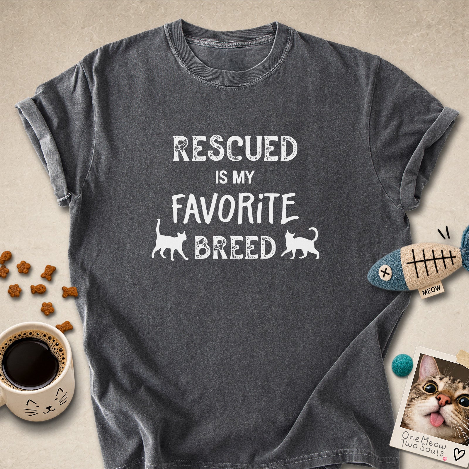 Pepper colored Comfort Colors 1717 cotton T-shirt, featuring a "Rescued is my favorite breed" funny cat design. One Meow Two Souls brand.